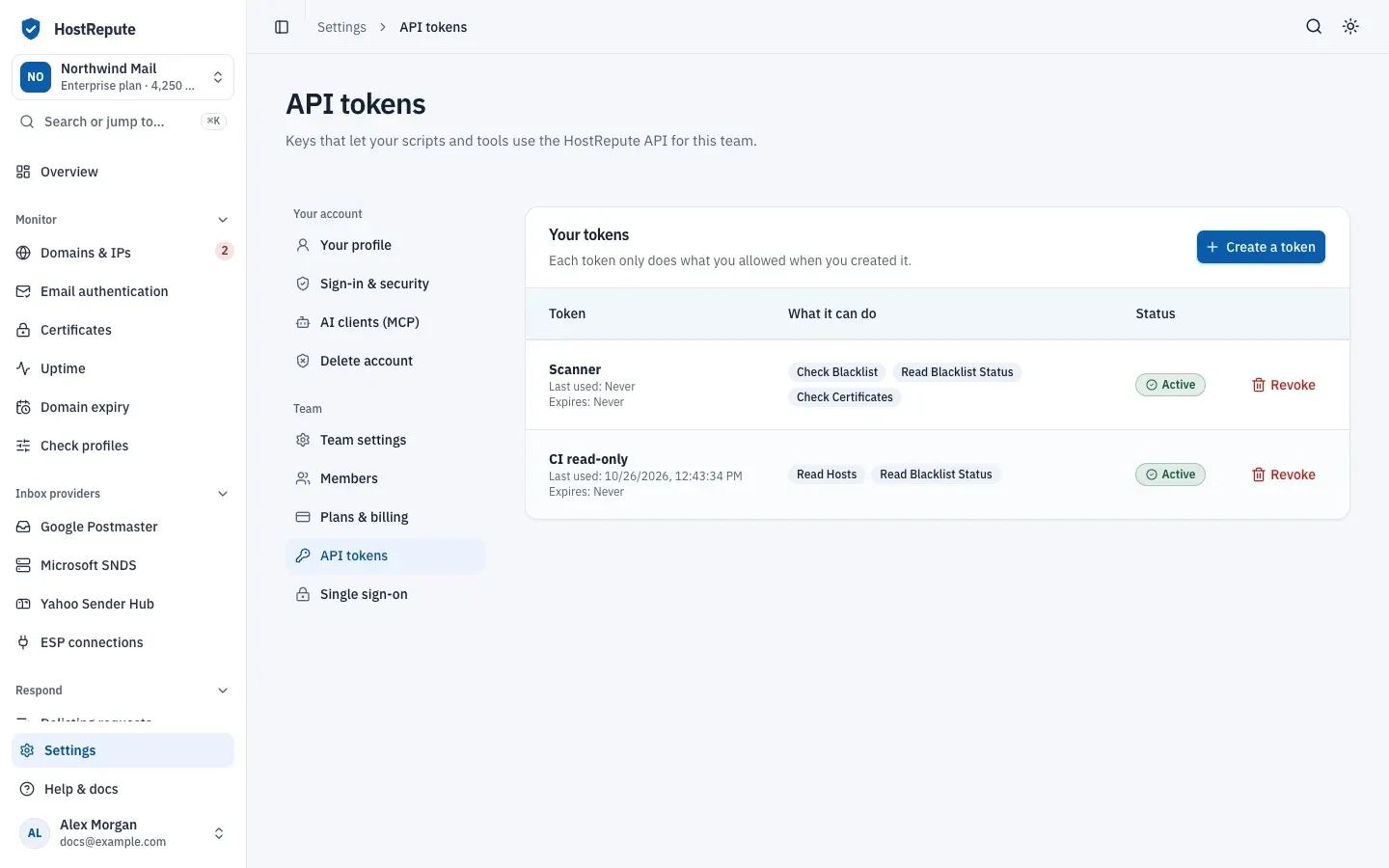 The API tokens page in team settings: the Your tokens list, each token with the abilities it holds, its status and a Revoke button, and the Create a token button.
